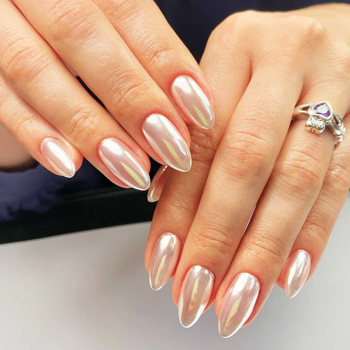 short almond nails with iridescent mirror chrome finish white chrome nails