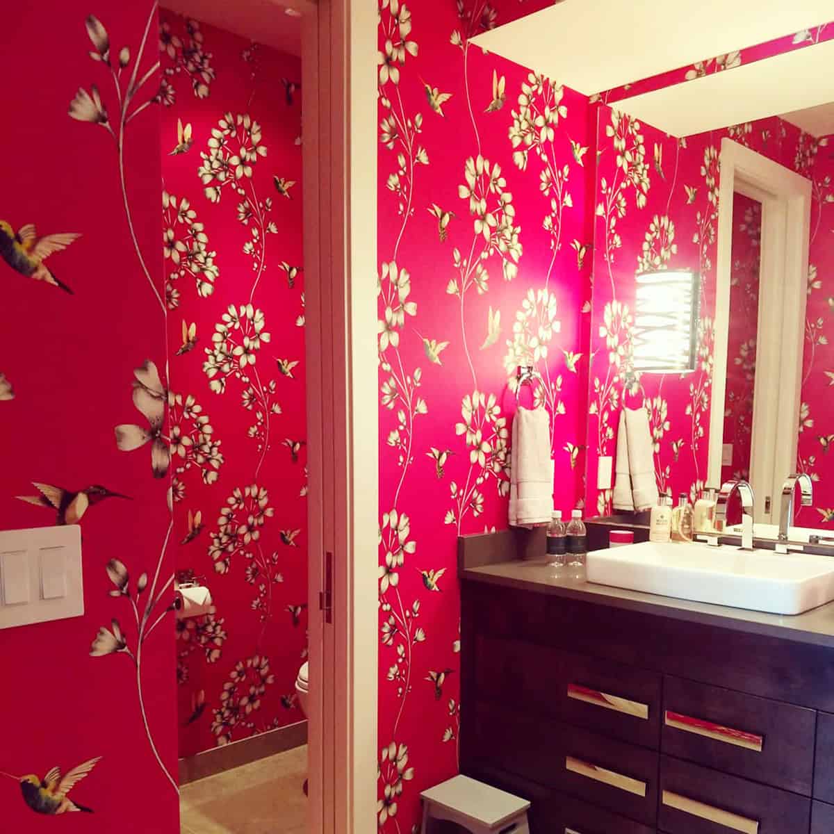 cerise pink wallpaper with hummingbirds and white florals in a bathroom pink wallpaper ideas home decor