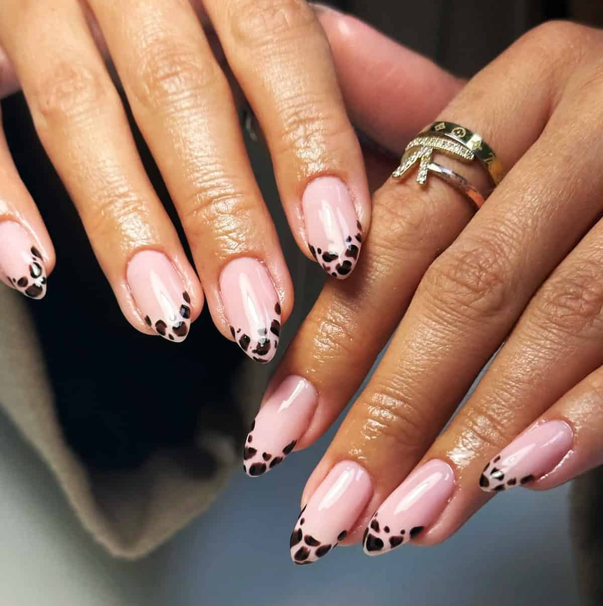 sheer pink almond tip black leopard print nails